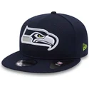 shapka-ploska-sinya-snapbek-9fifty-mesh-na-seattle-seahawks-nfl-ot-new-era
