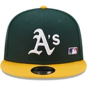 gorra-plana-verde-y-amarilla-snapback-9fifty-team-arch-de-oakland-athletics-mlb-de-new-era