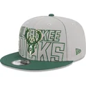 shapka-ploska-siv-snapbek-9fifty-draft-edition-2023-na-milwaukee-bucks-nba-ot-new-era
