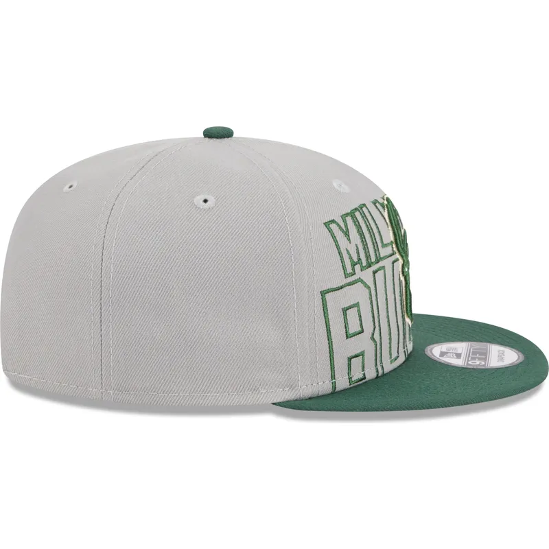 shapka-ploska-siv-snapbek-9fifty-draft-edition-2023-na-milwaukee-bucks-nba-ot-new-era