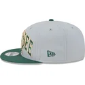 shapka-ploska-siv-snapbek-9fifty-tip-off-2023-na-milwaukee-bucks-nba-ot-new-era