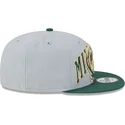 shapka-ploska-siv-snapbek-9fifty-tip-off-2023-na-milwaukee-bucks-nba-ot-new-era