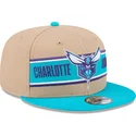 braune-und-blaue-snapback-kappe-9fifty-draft-2024-der-charlotte-hornets-nba-von-new-era