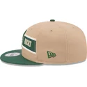 braune-und-grune-flache-snapback-kappe-9fifty-draft-2024-von-milwaukee-bucks-nba-von-new-era