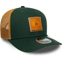 grune-und-braune-9seventy-stretch-snap-trucker-kappe-mit-gepragtem-logo-der-oakland-athletics-mlb-von-new-era