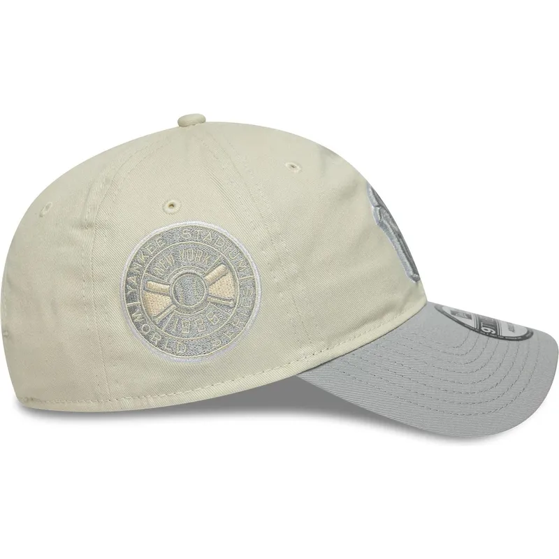new-era-izvita-kozirka-damska-9twenty-world-series-cooperstown-new-york-yankees-mlb-bezhova-i-siva-reguliruema-shapka