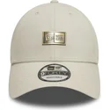 new-era-curved-brim-9forty-badge-beige-adjustable-cap