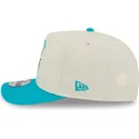 casquette-courbee-beige-et-bleue-snapback-9fifty-a-frame-precurved-hardwood-classics-charlotte-hornets-nba-new-era