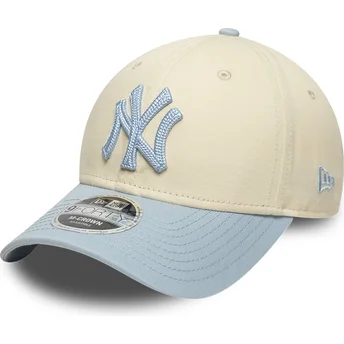 Beige und blaue gebogene Snapback-Kappe mit blauem Logo 9FORTY M-Crown Side Script der New York Yankees MLB von New Era